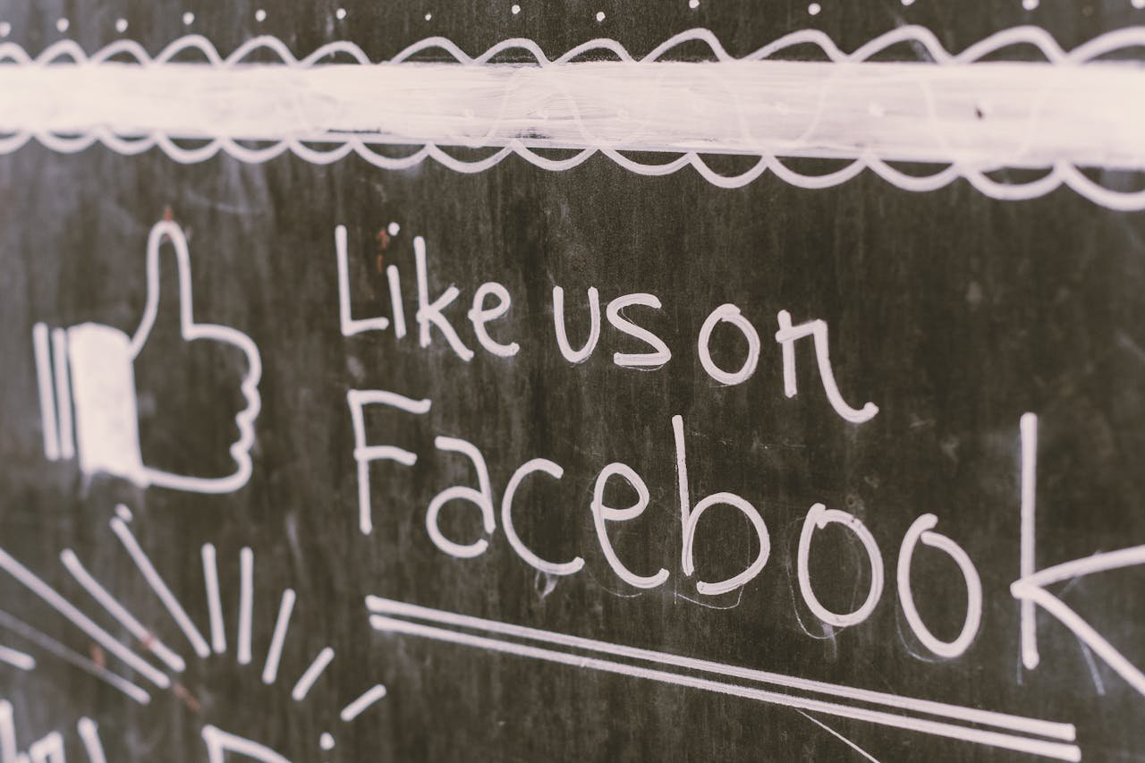 Home Chalkboard art promoting Facebook engagement with a like us message.